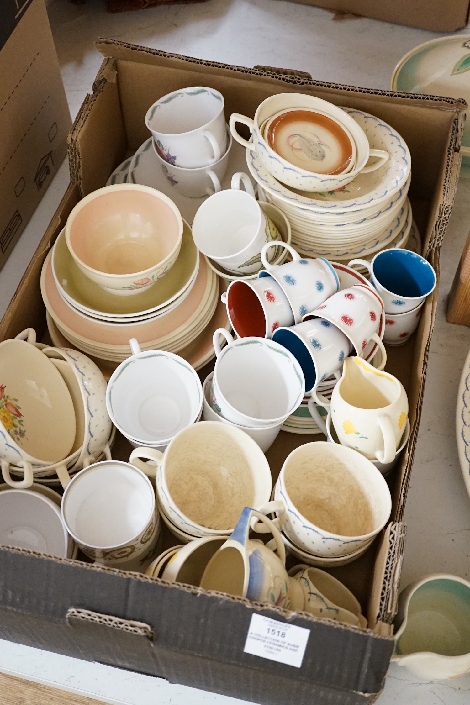 A collection of Susie Cooper ceramics and tablewares including tureens, an oval platter, cups and saucers